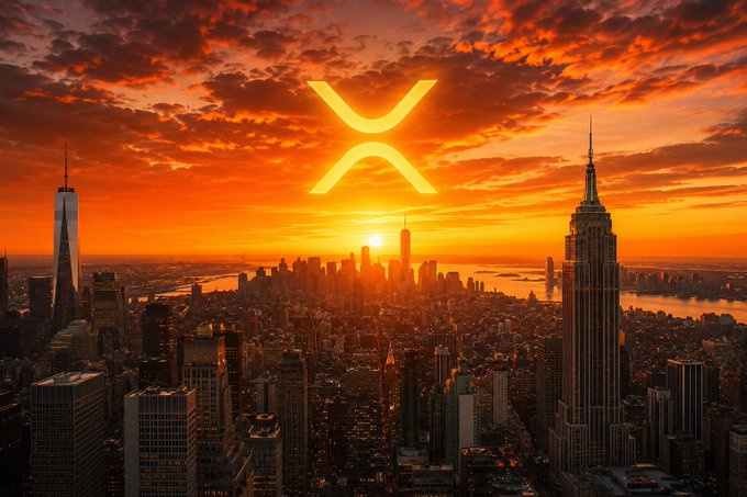 The XRP logo glows prominently over a dramatic sunset skyline of New York City, symbolizing optimism and resilience for crypto holders despite market uncertainty.

The image pairs with the post by visualizing XRP's presence amid the financial capital, reinforcing the message of patience and discipline during market downturns.