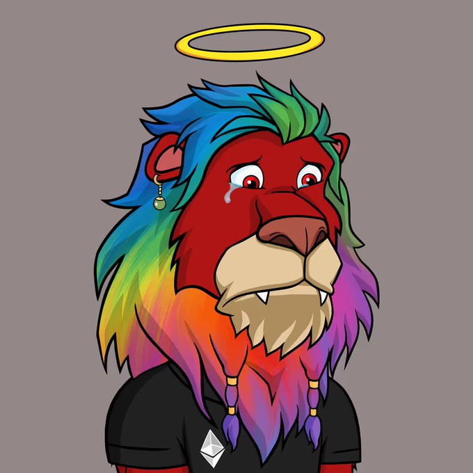 A cartoon red ape-like character with rainbow-blue, green, orange, and purple mane, red eyes, a beige muzzle, tusks, and a yellow halo above its head.