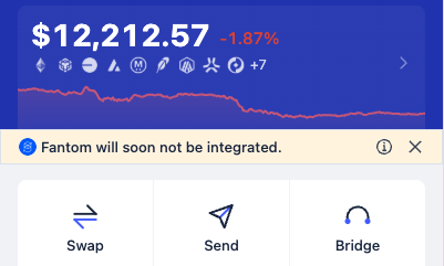 A cryptocurrency wallet interface displaying a balance of $12,212.57 (-1.87%) with an alert 'Fantom will soon not be integrated,' and Swap, Send, and Bridge buttons.