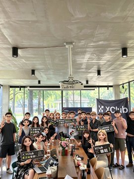 A group of attendees pose together at the OKX XClub Wuhan offline event, many holding signs reading "XCLUB," with the post capturing the author's first-time experience networking with web3 professionals in an unexpectedly relaxed setting.