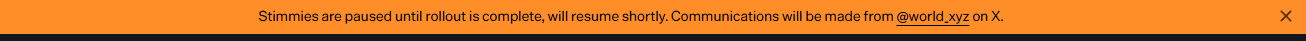 An orange banner displays the message "Stimmies are paused until rollout is complete, will resume shortly. Communications will be made from @world.xyz on X." alongside an "X" icon, indicating a temporary pause on rewards distribution from Worldcoin.