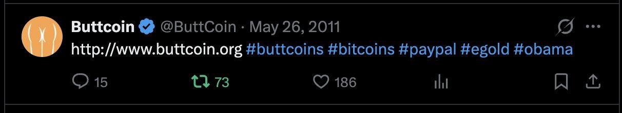 A screenshot of a May 26, 2011 tweet from verified account “Buttcoin” (@ButtCoin) linking to “http://www.buttcoin.org” with hashtags #buttcoins #bitcoins #paypal #egold #obama, showing 15 replies, 73 retweets, and 186 likes. The image supports the accompanying claim that Buttcoin was founded in May 2011, predating both Dogecoin’s origin and the Satoshi Nakamoto email hack.
