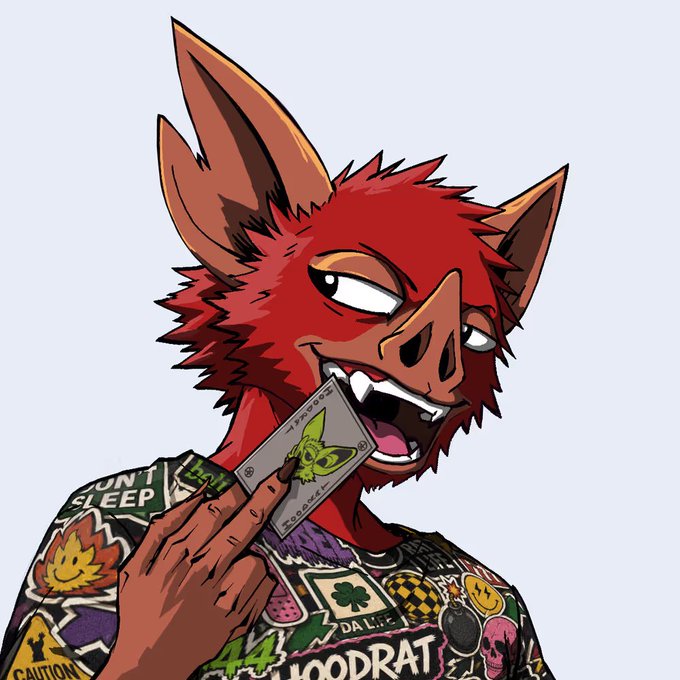 An illustrated anthropomorphic red canine character with pointed ears, sharp teeth, and amber eyes, biting into a card featuring a goblin design, while wearing a sticker-covered black jacket with patches like 'CAUTION' and 'HOODRAT'.