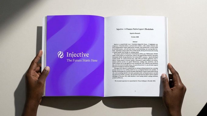 Two hands hold open a booklet displaying a document titled 'Injective: A Pioneer-Native Layer-1 Blockchain' dated October 2024, with the purple left page reading 'Injective - The Future Starts Here.'