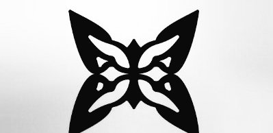 The image features an abstract black and white design resembling a butterfly with wings spread out. The butterfly is positioned centrally against a light gray background. Below the butterfly, there's text that reads "Gm gm CT The future of computing won'n belong to a handful of institutions. By creating a decentralized marketplace for quantum resources, @quipnetwork is making advanced computing more accessible to researchers, developers, and innovators everywhere."