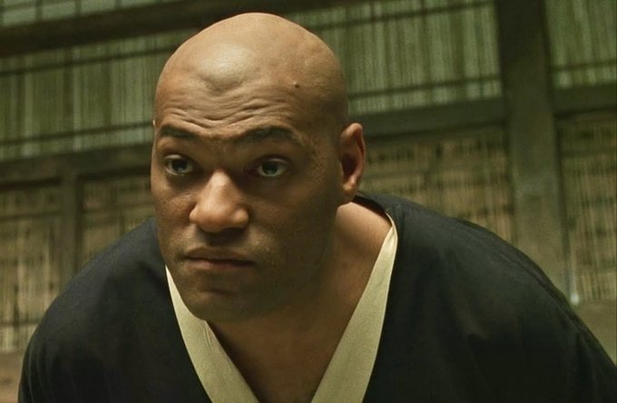 The image shows a close-up of Morpheus from The Matrix with an intense, contemplative expression, which mirrors the post's provocative tone implying hidden, yet-to-be-revealed revelations about Dogecoin's true potential bull run.