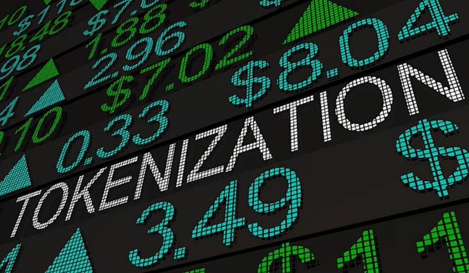 A close-up of a digital stock board displaying numbers, dollar amounts, and the word 'TOKENIZATION' in bright LED-style text.