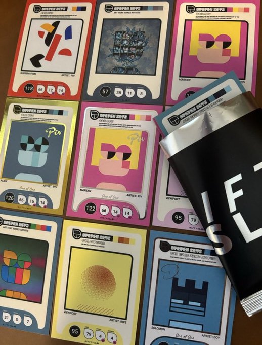 A collection of trading cards with colorful geometric designs and stats are laid out next to a black foil pack with large white letters, all labeled 'CRYPTOPUNK CARDS'.