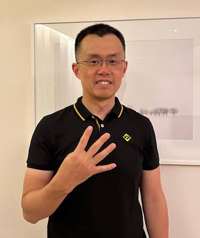 A man wearing glasses and a black polo shirt with a yellow logo smiles and holds up four fingers in front of a framed minimalist landscape artwork, with the accompanying post directing viewers to the Telegram channel "t.me/ALSTEIN_GEMCLUB" while encouraging those with a "wagmi" (we're all gonna make it) mentality to join.