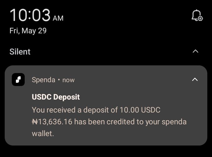 The image shows a phone screen displaying an email notification from a USDC deposit account. The message reads, "You received a deposit of 10,000 USDC." This information is relevant to the post because it suggests that someone has sent money through the USDC platform for a recipient named "spenda". The email also mentions that the transaction was processed on May 29th and that the user's wallet has been credited.