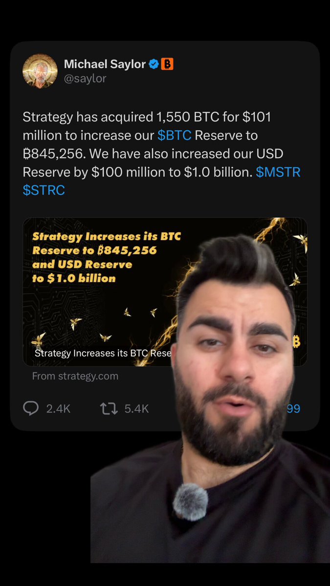 The image features a man with a beard wearing a black shirt, who appears to be a Twitter user or a social media account creator. The post includes a screenshot of himself along with some text about strategy increases for Bitcoin. The caption reads "What if Saylor is planning something... no one expects". This suggests that the post might be discussing the potential growth and impact of Bitcoin as a currency, given its increasing popularity among investors and users alike.