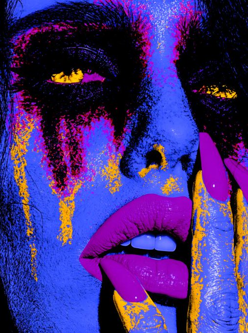 A vivid pop-art style close-up portrait of a face rendered in blue and magenta tones with bright yellow accents around the eyes and dripping down the cheeks.