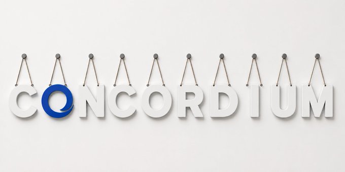 A 3D rendering of the word "CONCORDIUM" with the letter "O" stylized as a blue speech bubble, with each letter appearing to hang from strings on a white background.
