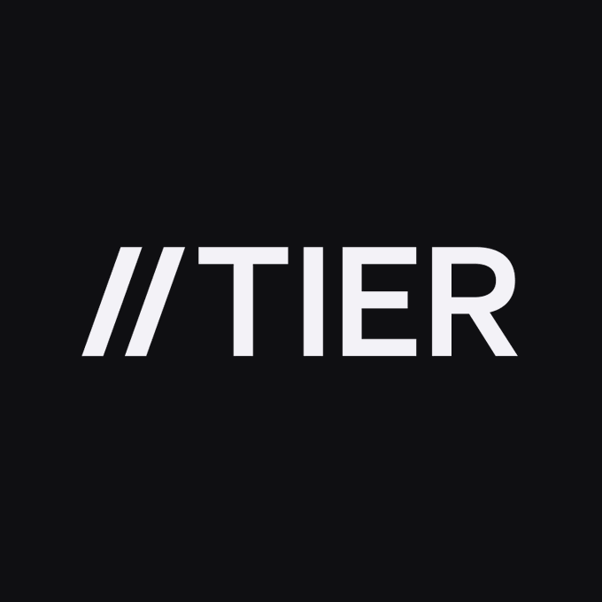 The image shows the logo for "TIER," featuring bold white text with two forward slashes ("//") preceding the name on a black background. This visual represents the Tier project (@tier_xyz), the new initiative launched by the co-founder of 1inch, which has drawn attention for its reportedly high-value domain acquisition.
