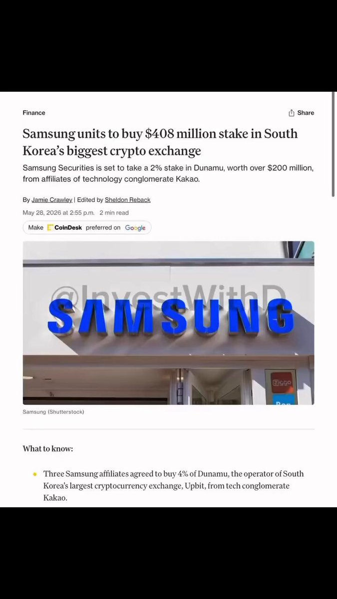 The image shows a close-up view of a front door of a Samsung store with the name "SAMSUNG" displayed above the entrance. The article about Samsung and XRP explains that Samsung has invested over $408 million in the company behind the world's largest XRP trading platform, Upbit. The post also mentions other subsidiaries of Samsung, including the parent company that acquired 3% of Upbit as a stake in "Dunamu" three Samsung subsidiaries have agreed to acquire. This is an important development for the digital currency space and could impact the future performance of Upbit, XRP, and related companies.