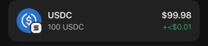 A screenshot showing a USDC cryptocurrency holding of 100 USDC valued at $99.98, displayed in a dark-themed wallet or portfolio interface with a price change indicator of "+<$0.01." The image appears to be shared as proof of holdings related to the telegram giveaway announcement for two winners.