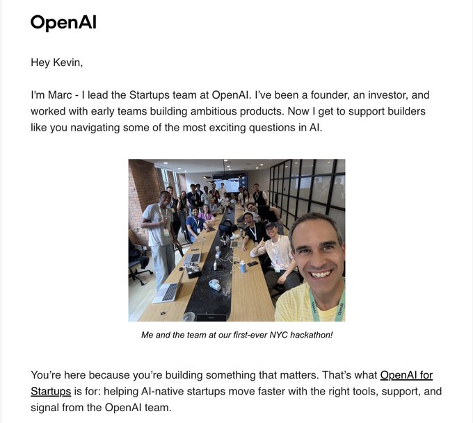 The image shows a personal outreach email from Marc at OpenAI's Startups team addressing "Kevin," introducing himself and promoting OpenAI for Startups. The email features a selfie of Marc with a group photo captioned "Me and the team at our first-ever NYC hackathon!" and highlights support for AI-native startups. The post's reference to "$GITLAWB" (Git Law / GitLab) likely suggests Kevin is being approached by OpenAI as a startup founder, implying the significance of receiving direct outreach from a major AI company leader.