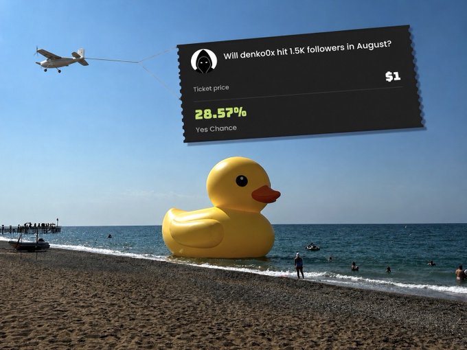 A giant yellow rubber duck on a beach with a prediction market banner asking 'Will denko0x hit 1.5K followers in August?' at 28.57% Yes Chance for $1.