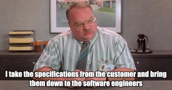 A screenshot from The Office featuring Brian Baumgartner as Kevin Malone, with the caption 'I take the specifications from the customer and bring them down to the software engineers'.