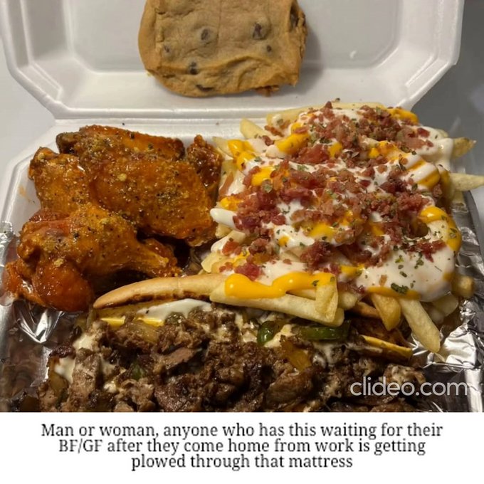A takeout container holds a hearty meal of chicken wings, loaded fries with cheese and bacon bits, cheesesteak, and a chocolate chip cookie, with humorous text below reading 'Man or woman, anyone who has this waiting for their BF/GF after they come home from work is getting plowed through that mattress'.