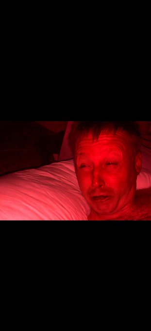 The image shows a man lying down with his eyes closed, possibly sleeping or resting. He has red hair that stands out against the dark background of the photo. The caption at the bottom of the image reads "Will the prophecy be fulfilled today?? $58k gang?". This suggests an intriguing and thought-provoking question about the future events in the depicted scene.

The man's position on a bed, with his eyes closed, adds to the overall atmosphere of mystery or anticipation surrounding the post. The red hair color further emphasizes this theme by providing a striking contrast against the dark background.