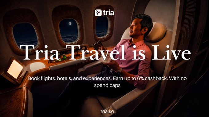 A promotional banner for 'tria' advertising 'Tria Travel is Live' with the tagline 'Book flights, hotels, and experiences. Earn up to 6% cashback. With no spend caps' and the URL tria.so.