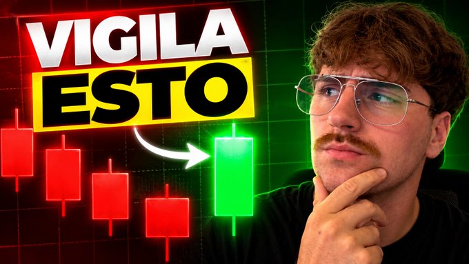A YouTube thumbnail with Spanish text "VIGILA ESTO" showing a man with glasses and a mustache looking thoughtful next to a candlestick chart transitioning from red to green bars.