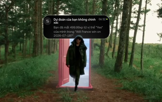 A surreal scene of a hooded figure walking through a door in a forest, overlaid with a Vietnamese-language notification stating "Dự đoán của bạn không chính xác" (Your prediction was incorrect) and a loss of 499.99 XP from betting 'Yes' on 'Will France win on 2026-07-18?'.