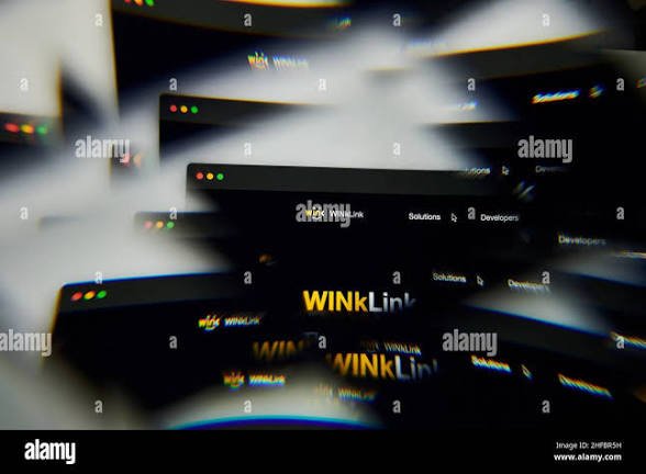 The image shows an array of computer monitors arranged in a circular pattern with the word "WINKLINK" prominently displayed at the center. The monitors are black and white, creating a visually striking contrast against each other. The text "TRON is one of those ecosystems. Over the years, TRON has grown beyond being just a blockchain network. It has become a thriving digital economy where developers, businesses, creators, and everyday users interact seamlessly across DeFi, stablecoins, payments, gaming, AI, and".