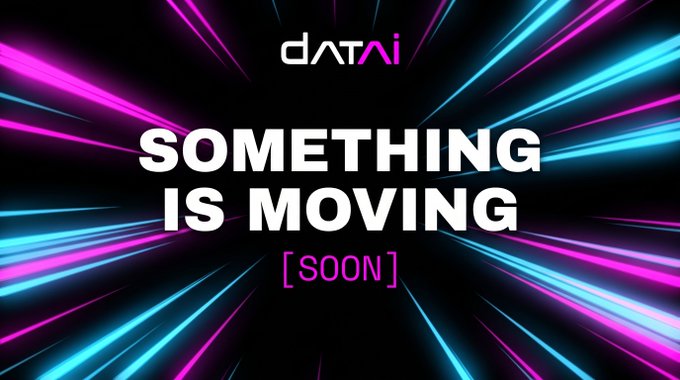 The image is a teaser graphic featuring the "datai" logo above the white text "SOMETHING IS MOVING" with "[SOON]" in pink below, set against a dynamic black background with radiating pink and cyan light streaks. It visually reinforces the post's announcement that Datai Network is preparing to unveil a new development, building anticipation for an upcoming reveal.