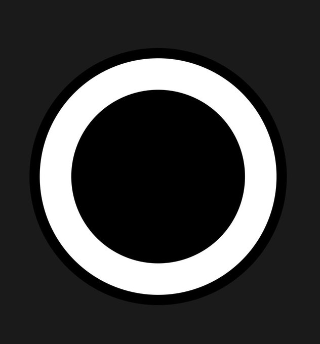 A simple black and white circular icon consisting of a thick white ring around a solid black center on a dark gray background.