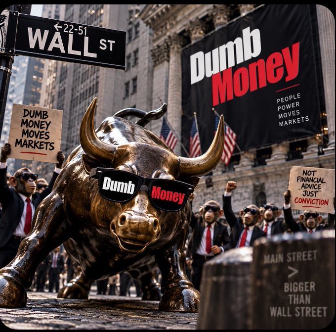 The bronze Wall Street bull statue wearing 'Dumb Money' sunglasses stands in front of protesters holding signs that read 'DUMB MONEY MOVES MARKETS' and 'NOT FINANCIAL ADVICE JUST CONVICTION'.