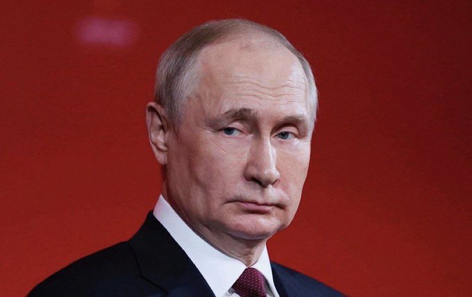 Russian President Vladimir Putin appears in a portrait, relating to the news that Russia has approved Bitcoin, Ethereum, and USDT for trading on its exchanges.