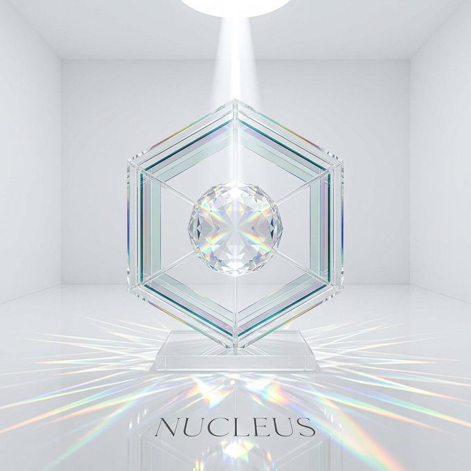 A crystalline dodecahedron with a faceted sphere at its core sits on a pedestal in a minimalist white room, refracting a rainbow of light across the floor beneath the text "NUCLEUS." The geometric, light-refracting sculpture visually reinforces the post's theme of NucleusCodes constructing a sophisticated, transparent "routing layer" for onchain reputation.