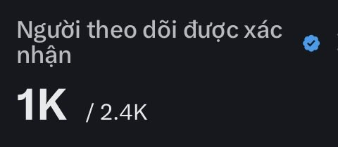 The image shows a black and white photo of a sign with text written in Vietnamese, which reads "1k / 2k" along with some other text. The main focus of the image is the sign itself, but there are also some small details visible that might be related to the content on the sign.
