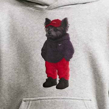 A gray hoodie features a printed graphic of a small black dog wearing a red cap, a black hoodie, red sweatpants, and black shoes.