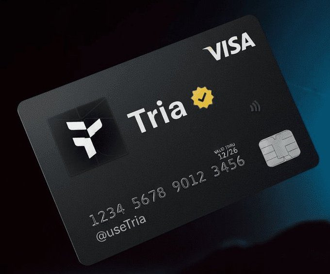 Product image of a black Tria Visa credit card displayed against a dark background, featuring the Tria logo, contactless symbol, and card number 1234 5678 9012 3456.