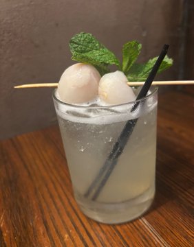 The image features a tall glass filled with a white drink, possibly a cocktail or a non-alcoholic beverage like lemonade. The drink has a straw sticking out of it, adding a touch of whimsy to the scene. In addition to the main subject, there are two other objects in the background that contribute to the overall composition: a green plant and a black object on the table. The post reads "It's time to party $algo brothers", which suggests that this image might be related to an event or gathering where people are enjoying drinks and socializing with each other, possibly including some algo brothers in their conversations.