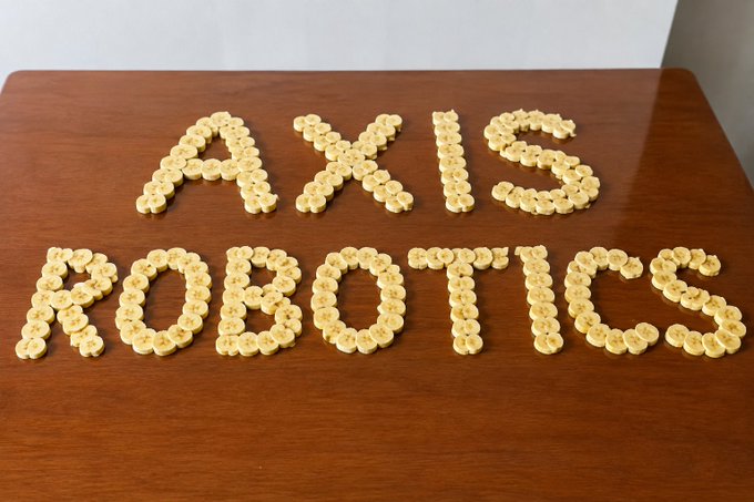 Banana slices arranged on a wooden table spell out "AXIS ROBOTICS," visually reinforcing the Axis Robotics rewards campaign mentioned in the post, where creators are encouraged to stay active as distribution approaches.
