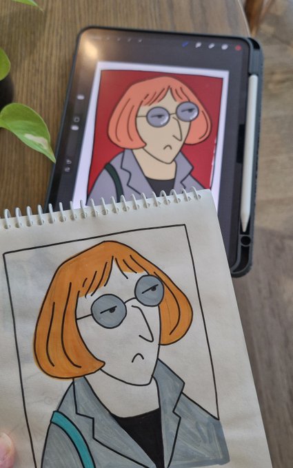A hand-drawn sketch of a woman with orange hair and round glasses on a spiral notebook, displayed next to the digital reference image on a tablet.