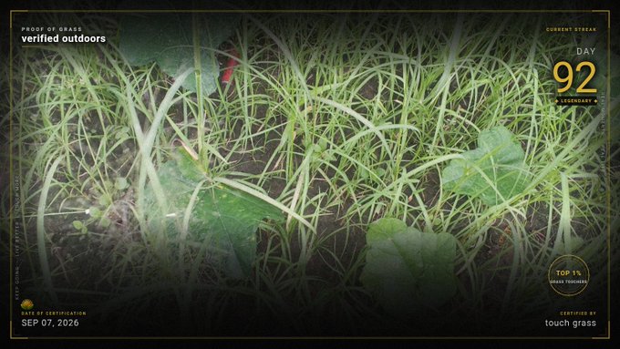 A close-up shot of grass with overlay graphics reading "PROOF OF GRASS verified outdoors", "DAY 92 LEGENDARY", and "CERTIFIED BY touch grass" dated SEP 07, 2026.
