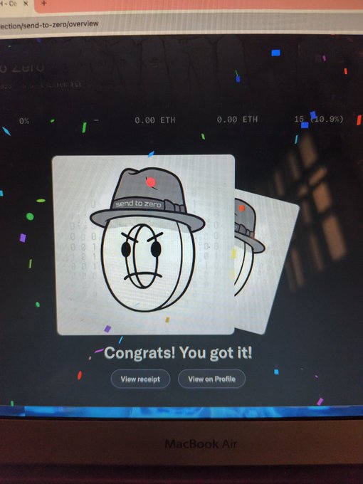 A MacBook Air screen displaying a digital collectible receipt with an emoji face wearing a hat, captioned 'Congrats! You got it!' with options to 'View receipt' and 'View on Profile'.