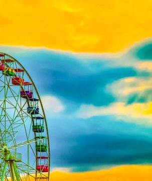 A Ferris wheel silhouetted against a dramatic sky with bright yellow and deep blue clouds in vibrant, saturated colors.