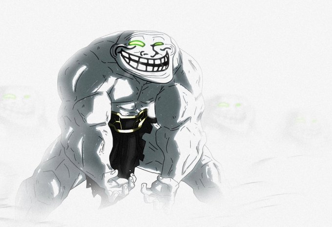 A digital illustration of a massive, grey, rocky creature with glowing green eyes and a wide, toothy grin, wearing black shorts with a gold belt.