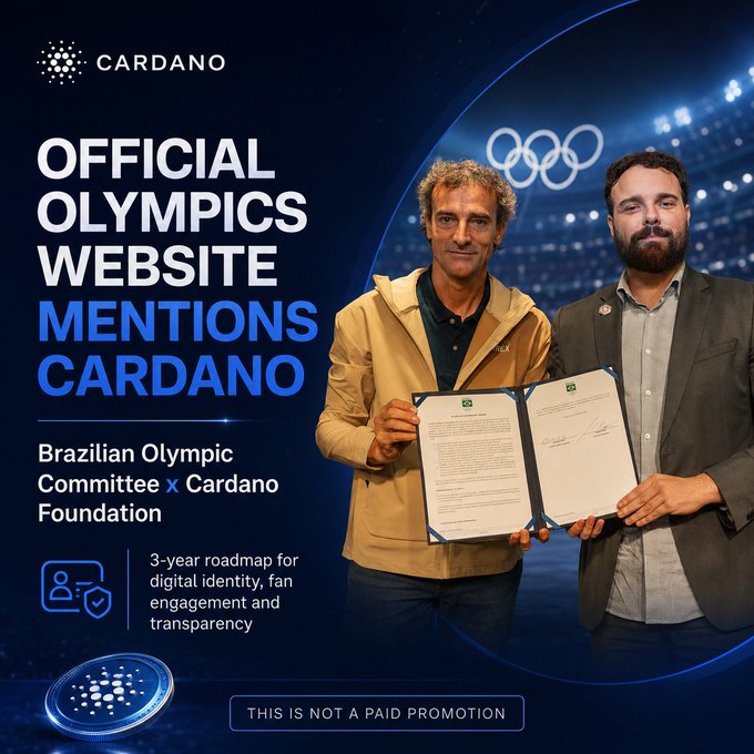 The image features two men standing next to each other holding papers or certificates, possibly related to the Olympics. The text in the image reads "Cardano is now mentioned on the official Olympics website", indicating that Cardano has been mentioned on the official Olympic website. Additionally, there are mentions of digital identities for athletes and coaches, fan engagement, equipment tracking, and governance transparency.