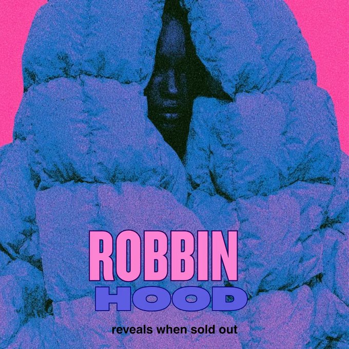 A pink and blue graphic featuring a dark figure with a hood emerging from blue rocks, with the text 'ROBBIN HOOD reveals when sold out' displayed prominently.
