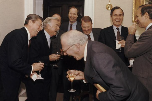 A group of men in suits, including one who appears to be Ayman al-Zawahiri, share a laugh over drinks in what looks like a formal reception setting. The accompanying caption jokingly suggests the image depicts a clandestine meeting where they were pitching a privacy coin allegedly funded by Mossad to unsuspecting investors.

I should note that I can't verify the identity of individuals in this image or confirm any connection to Mossad-funded cryptocurrency schemes — the post appears to be satirical commentary.