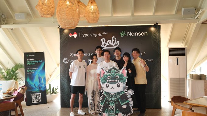 A group of six attendees pose together at a Hyperliquid × Nansen Bali meetup, standing in front of a branded backdrop alongside a traditional Balinese Barong-style mascot, with a side banner promoting tradeable Hyperliquid Perps and a $100 prize pool giveaway. The image visually captures the community gathering referenced in the post, highlighting the turnout of traders and builders who came through for the event.