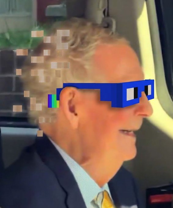 A man with blonde hair wearing pixelated blue sunglasses is shown in profile, appearing to be inside a vehicle.