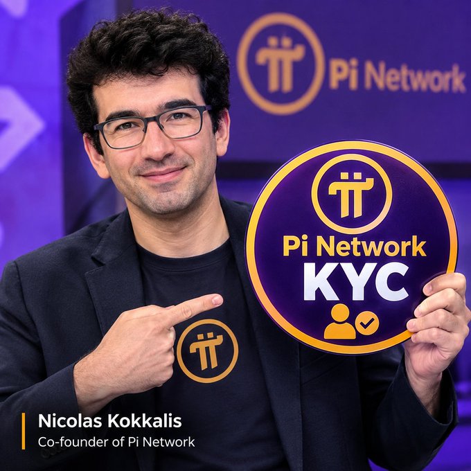 Nicolas Kokkalis, Co-founder of Pi Network, smiles and points to a circular 'Pi Network KYC' badge he is holding.